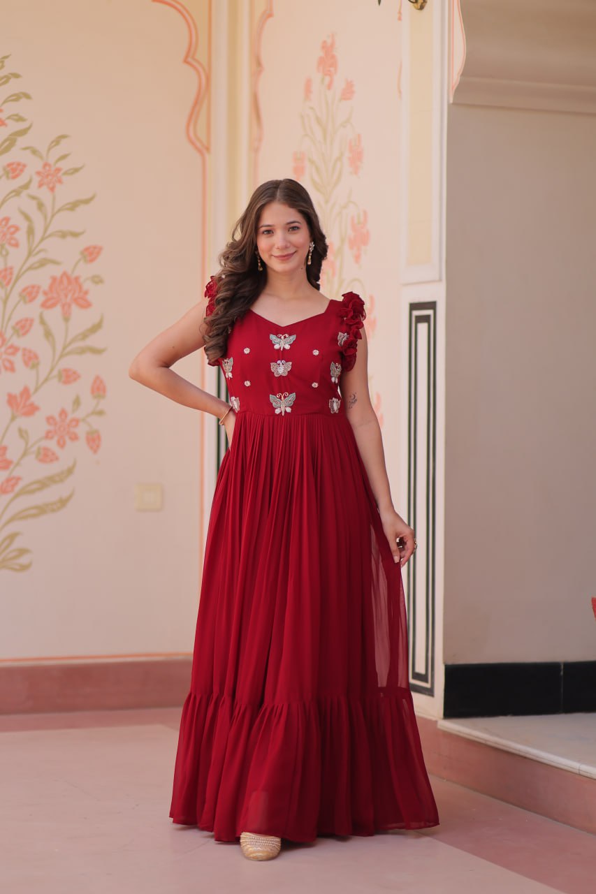 Lavi 7-meter flared designer gown in faux blooming fabric with sequin & bead embroidery, V-neck & frill shoulders – perfect for weddings & parties.